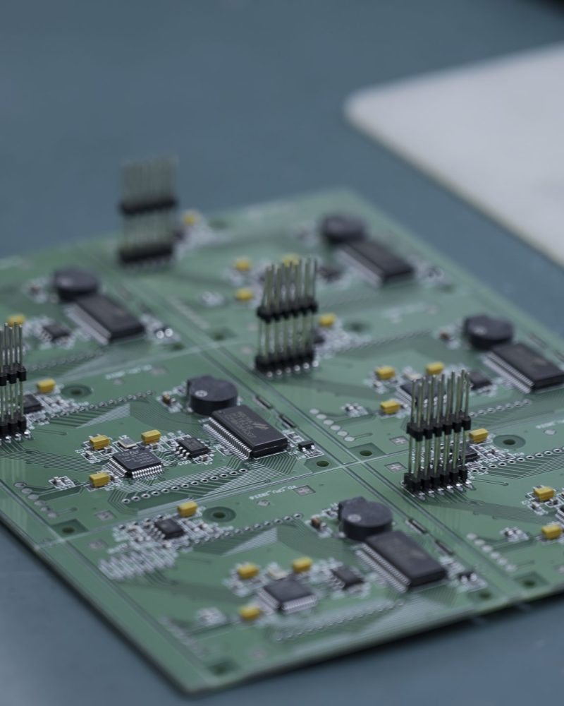 Young man repairing computer components in service center. Creative. Close up of soldering the chip